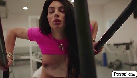 Slutty brunette with big boobs rides a huge dick in the gym