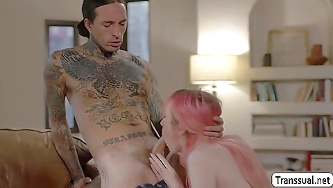 A busty redhead gets fucked in her mouth and asshole