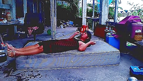 Asian brunette ladyboy with a sexy bikini in outdoor solo