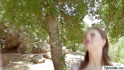 Brunette enjoys playing with a hard cock and takes it deep throat